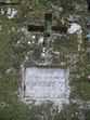 A memorial plaque above a cavern entrance
